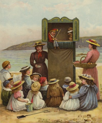 Kinder schauen sich eine Punch-und-Judy-Show am Strand an von English School